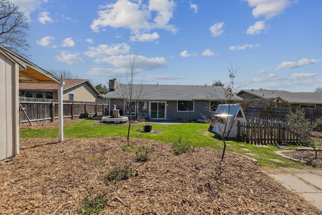 12810 Irongate Ave, Austin, TX 78727 - rear view of house featuring a fenced backyard and a chimney