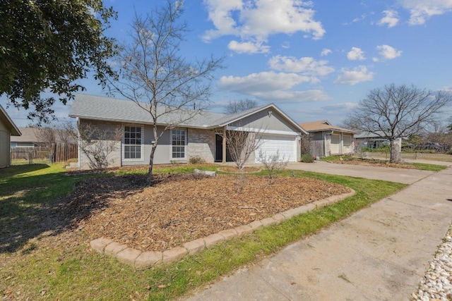 single story home featuring a garage, driveway, and fence