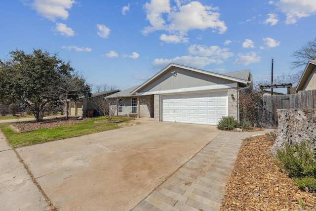 12810 Irongate Ave, Austin, TX 78727 - ranch-style home featuring brick siding, a garage, and driveway