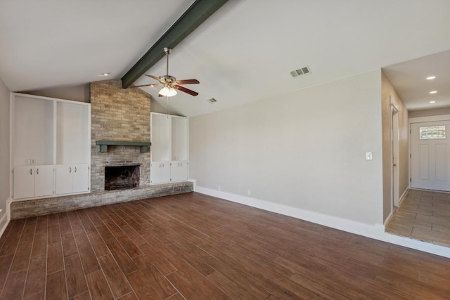 12810 Irongate Ave, Austin, TX 78727 - unfurnished living room featuring a ceiling fan, dark wood finished floors, a large fireplace, and recessed lighting