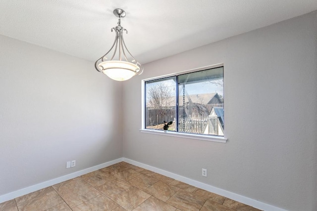 12810 Irongate Ave, Austin, TX 78727 - spare room featuring baseboards