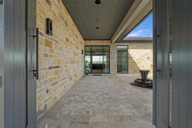 2923 Cliff Pt, Spicewood, TX 78669 - entrance to property with a patio and stone siding