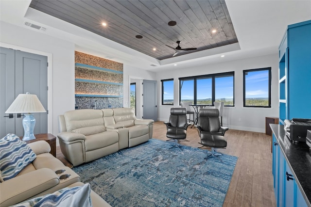 2923 Cliff Pt, Spicewood, TX 78669 - living area featuring a tray ceiling, wooden ceiling, baseboards, light wood finished floors, and ceiling fan