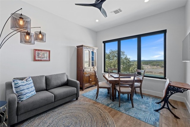 2923 Cliff Pt, Spicewood, TX 78669 - dining area with light wood finished floors, recessed lighting, a ceiling fan, and baseboards
