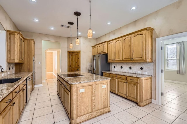 210 Amandas Way, Leander, TX 78641 - kitchen with appliances with stainless steel finishes, decorative backsplash, light tile patterned floors, a kitchen island with sink, and recessed lighting
