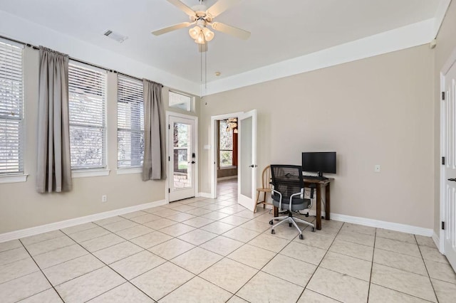 office area with light tile patterned floors, baseboards, visible vents, and a ceiling fan