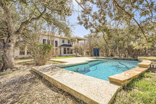 outdoor pool featuring a patio