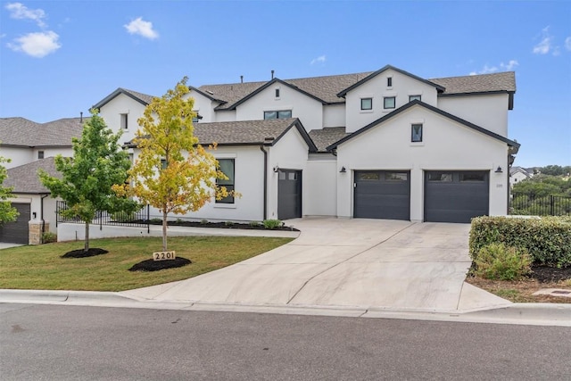 2201 Bel Paese Bnd, Leander, TX 78641 - modern inspired farmhouse with fence, a front lawn, a garage, stucco siding, and driveway