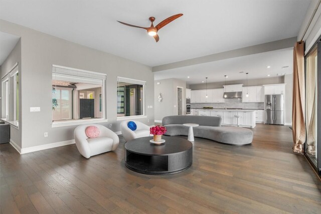 2201 Bel Paese Bnd, Leander, TX 78641 - living room with recessed lighting, baseboards, ceiling fan, and dark wood-type flooring