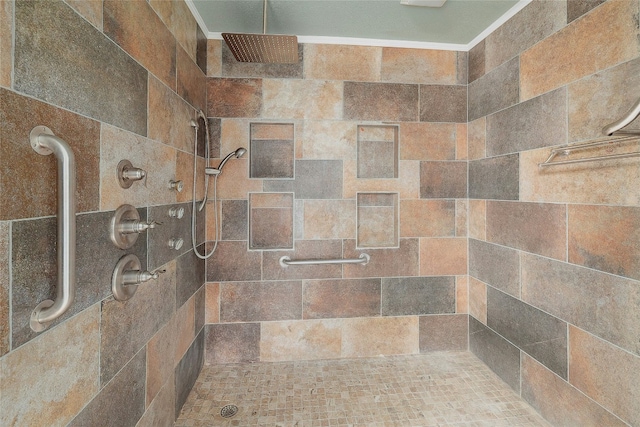 bathroom with a tile shower