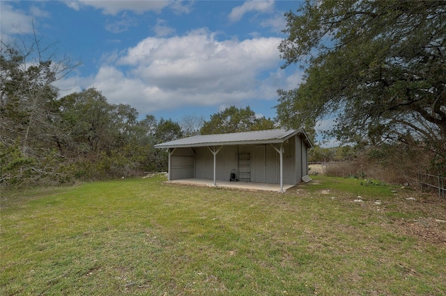 view of pole building with a yard