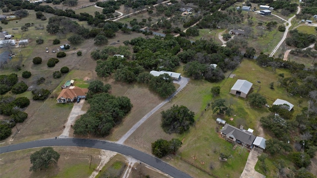 birds eye view of property with a rural view