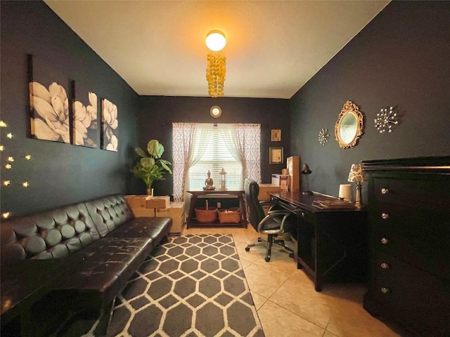 office featuring lofted ceiling and light tile patterned floors
