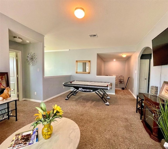 playroom with arched walkways, carpet flooring, visible vents, and baseboards