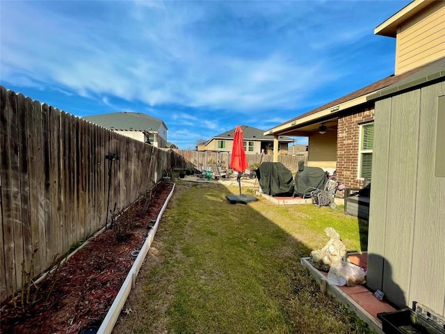 view of yard with a fenced backyard