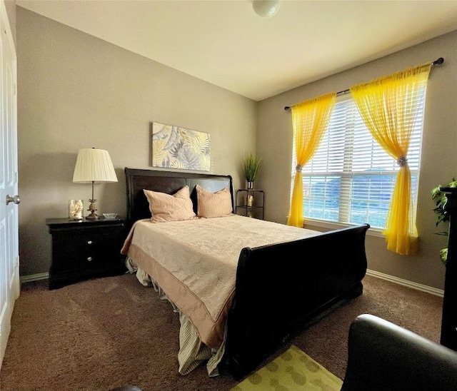 carpeted bedroom with baseboards