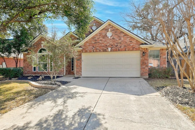 view of front facade with concrete driveway, brick siding, and an attached garage