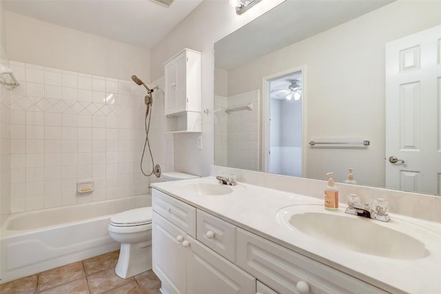 full bathroom with toilet, a sink,  shower combination, tile patterned floors, and double vanity