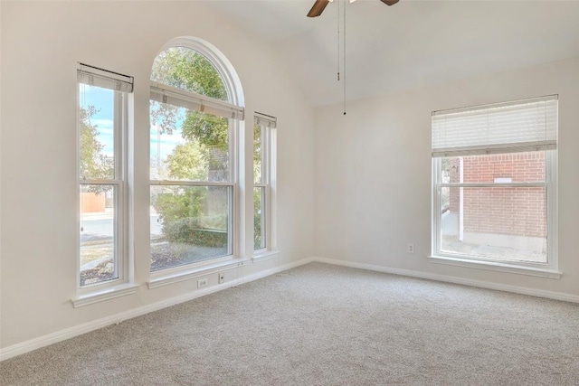 unfurnished room featuring vaulted ceiling, ceiling fan, carpet flooring, and baseboards