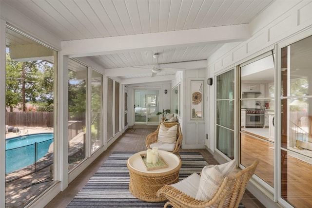 sunroom / solarium featuring wooden ceiling and beamed ceiling