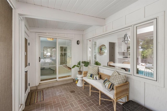 sunroom / solarium with wooden ceiling and beamed ceiling