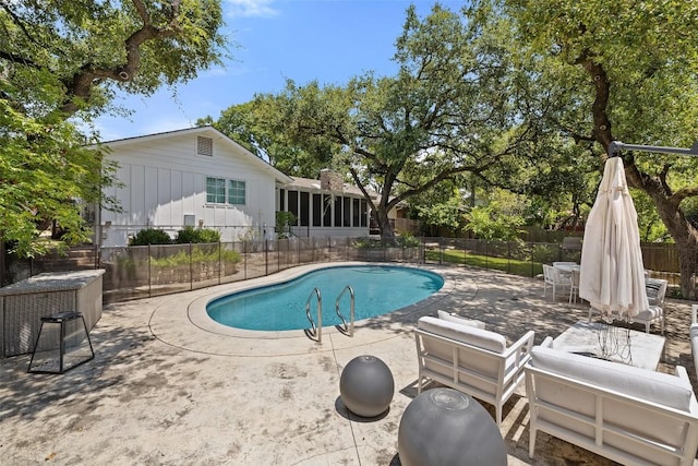 view of pool with a patio, fence, and a fenced in pool