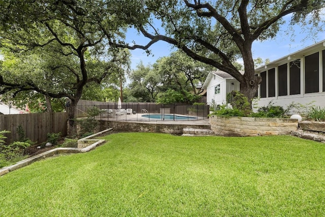 view of yard featuring a fenced backyard and a fenced in pool