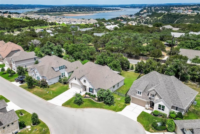 bird's eye view featuring a residential view and a water view