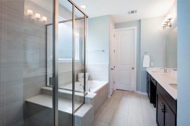 bathroom with double vanity, visible vents, a shower stall, and a bath