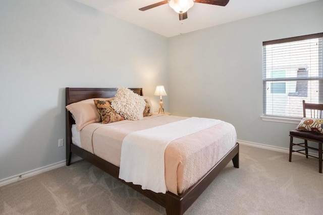 bedroom featuring carpet, a ceiling fan, and baseboards