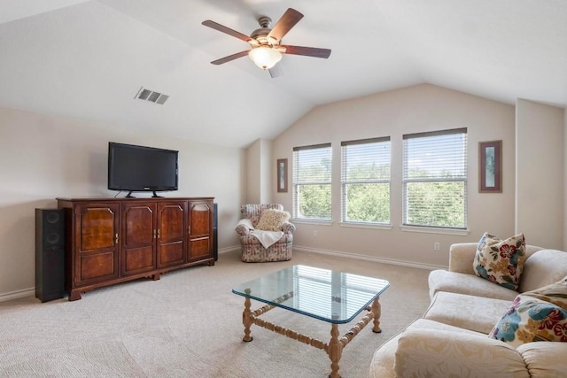 living area with baseboards, visible vents, a ceiling fan, light colored carpet, and lofted ceiling