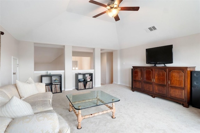 living area featuring carpet floors, visible vents, baseboards, vaulted ceiling, and a ceiling fan