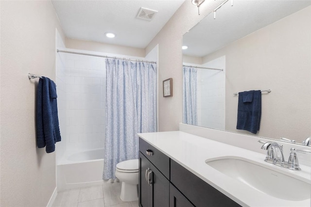 full bathroom featuring shower / bath combo, visible vents, toilet, tile patterned flooring, and vanity