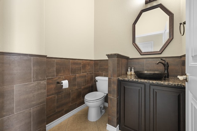 224 Tavish Trl, Austin, TX 78738 - bathroom with tile walls, vanity, a wainscoted wall, and tile patterned floors