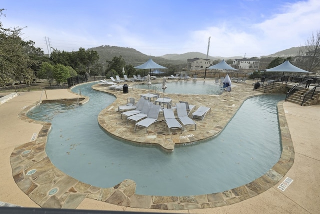 224 Tavish Trl, Austin, TX 78738 - community pool featuring a patio area and a mountain view