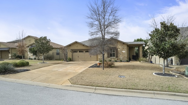 view of front of house with a garage, stone siding, and driveway