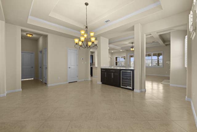 224 Tavish Trl, Austin, TX 78738 - unfurnished room featuring wine cooler, a chandelier, a raised ceiling, and light tile patterned flooring