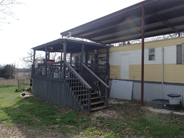 exterior space featuring stairway and a deck