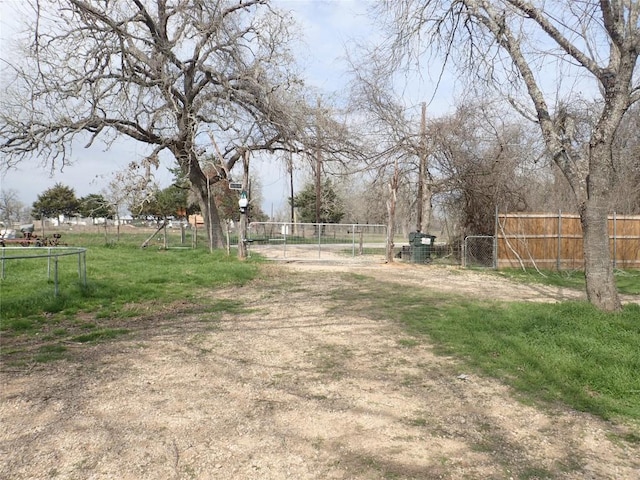 view of road featuring a gate