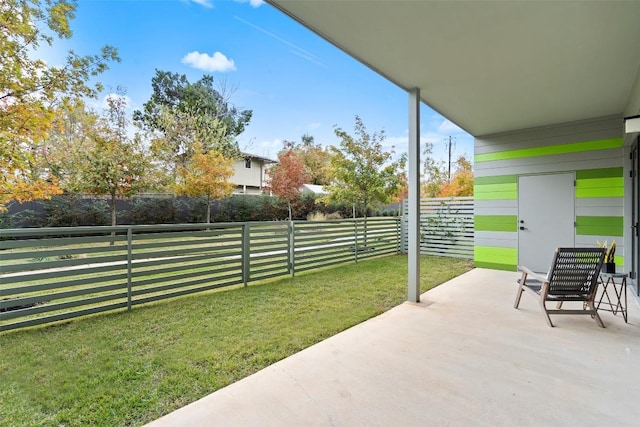 view of patio / terrace featuring fence