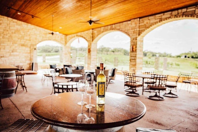 view of patio featuring ceiling fan and outdoor dining area