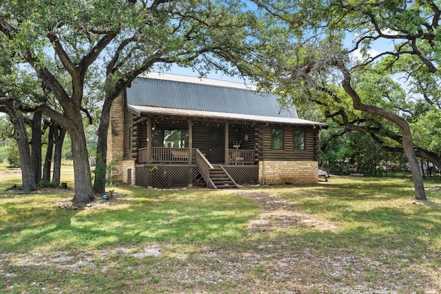 log cabin with metal roof, a front lawn, log siding, and a porch