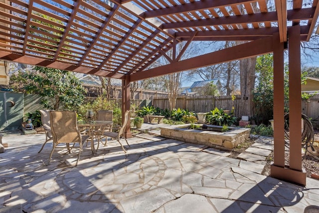 view of patio with a fenced backyard, a pergola, and outdoor dining space