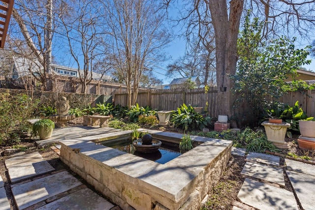 view of patio / terrace featuring fence