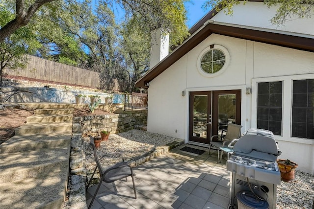 view of patio / terrace with grilling area and fence