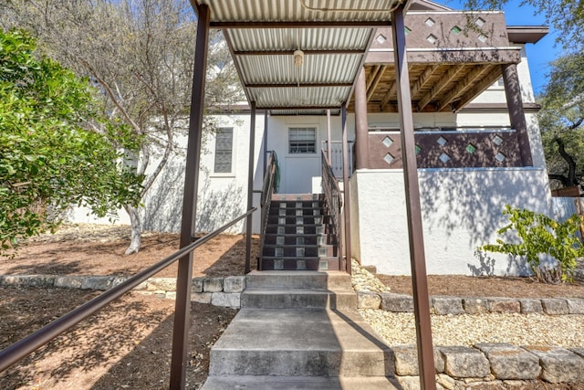 property entrance featuring stucco siding