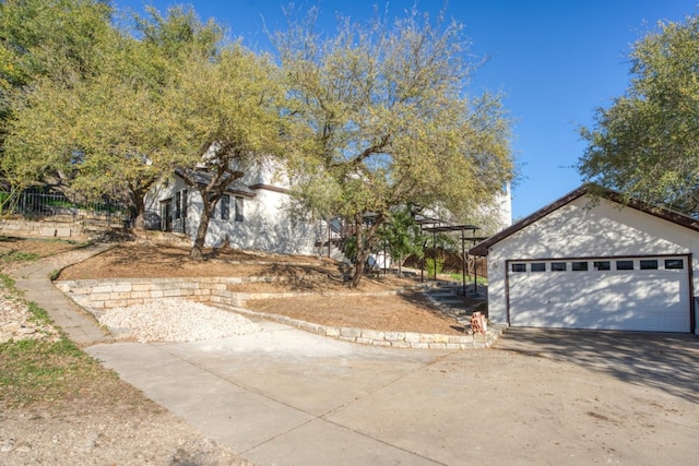 view of front facade featuring a garage and concrete driveway