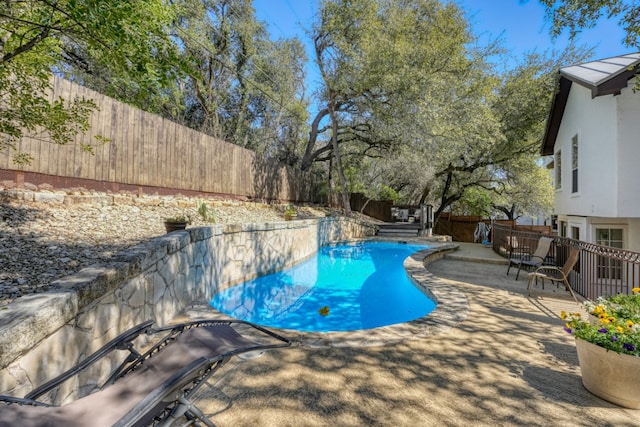 view of pool featuring a fenced backyard and a fenced in pool