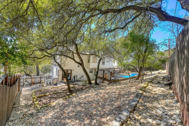 view of yard featuring a fenced backyard and a patio