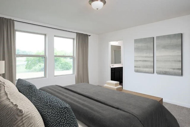 carpeted bedroom with baseboards